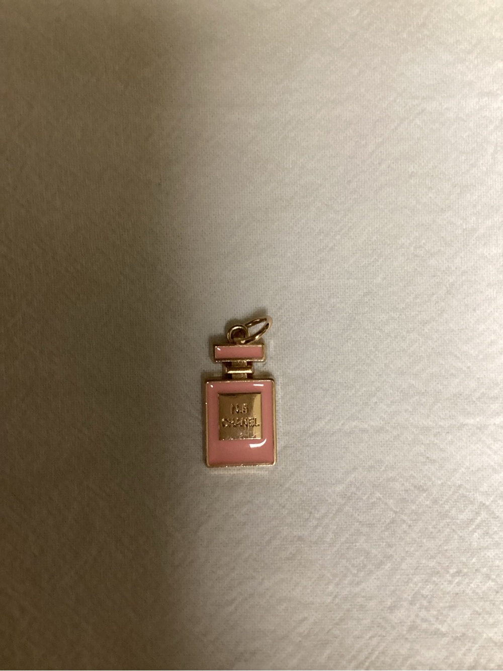 CHANEL Pink Perfume Bottle Charm with Gold Accents